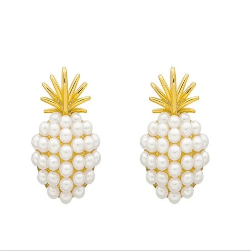 Gold Korean-style alloy earrings with pineapple starfish design and pearl-coloured gem inlays.