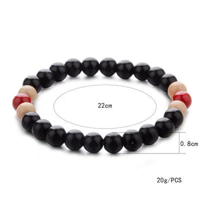 Natural lava stone beaded bracelet for essential oils, ethnic style, on a white background.