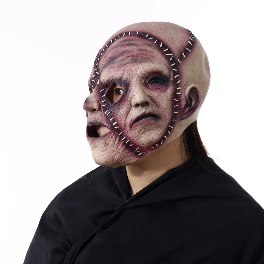 Three-sided grimace horror mask showing three distinct grotesque faces in natural latex