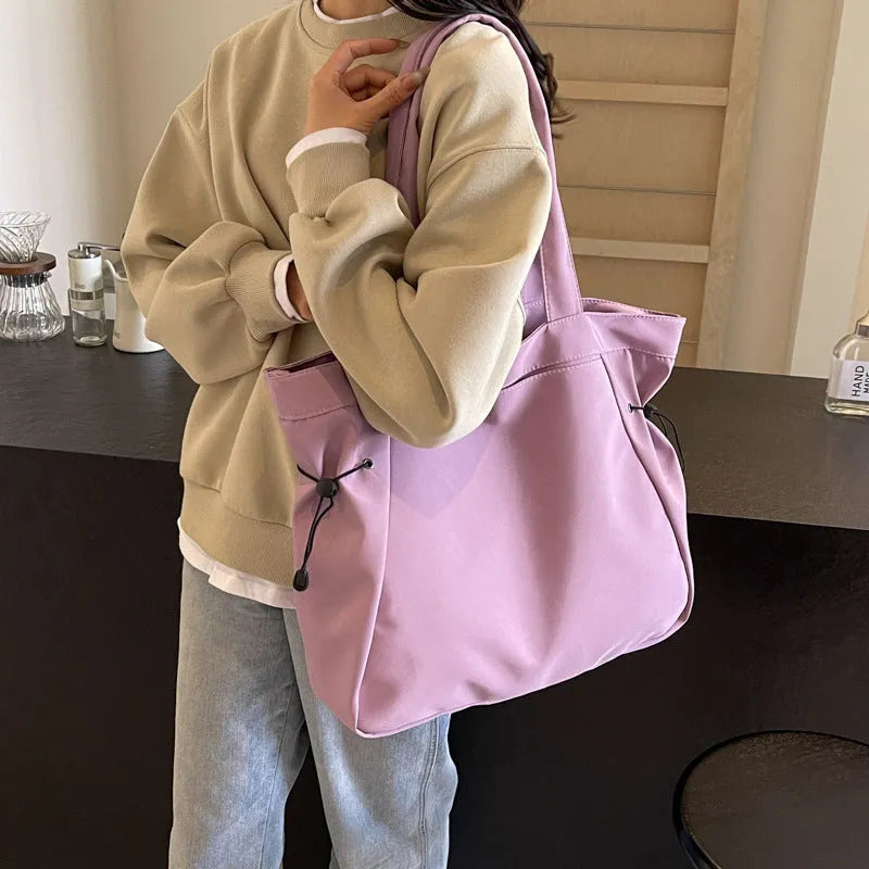 Soft Oxford cloth folding shoulder tote bag shown in available colour options