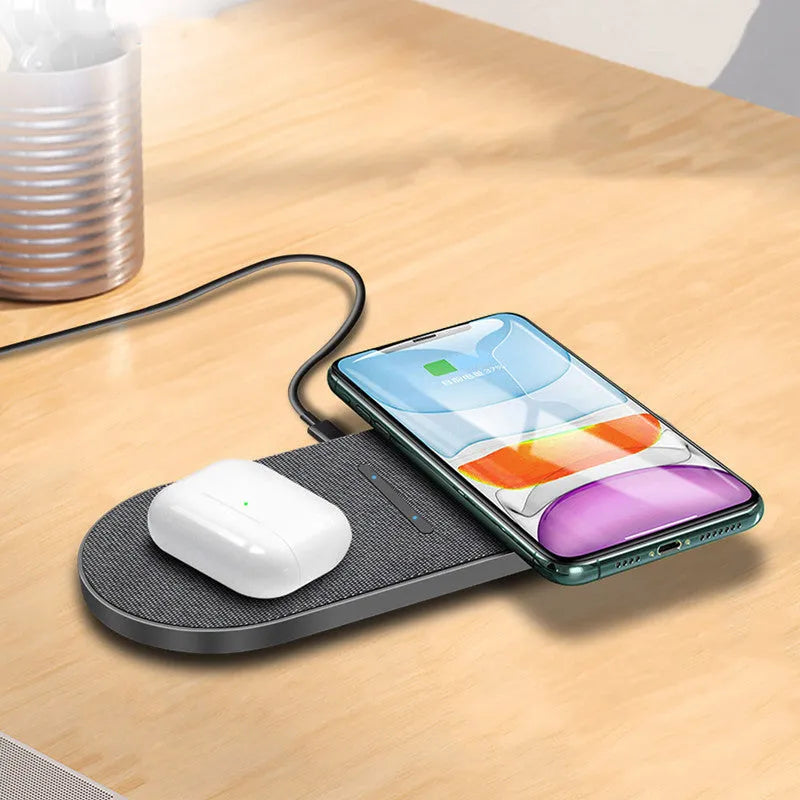 Black 10W dual wireless charging pad set with LED lights, shown charging two smartphones.