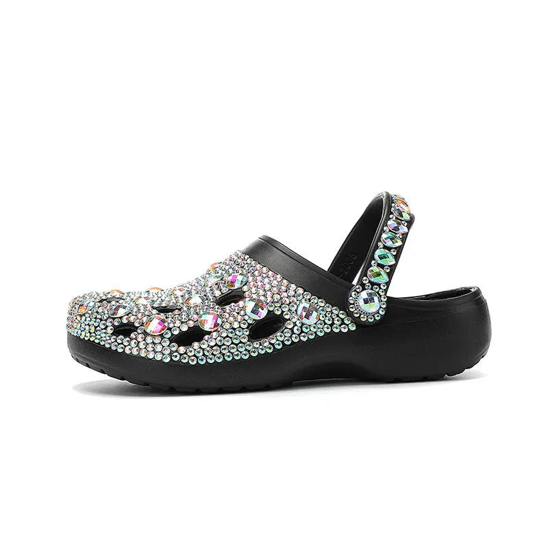 Black women's platform sandals with rhinestones around holes and a textured EVA sole.