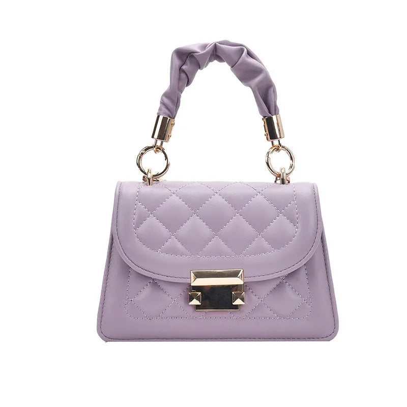 Purple rhombus-shaped small square shoulder bag with crossbody strap against neutral background