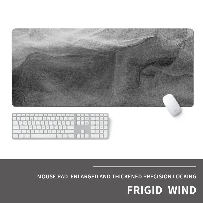 Oversized thick gaming mouse pad with printed e-sports design on a desk with keyboard and mouse.