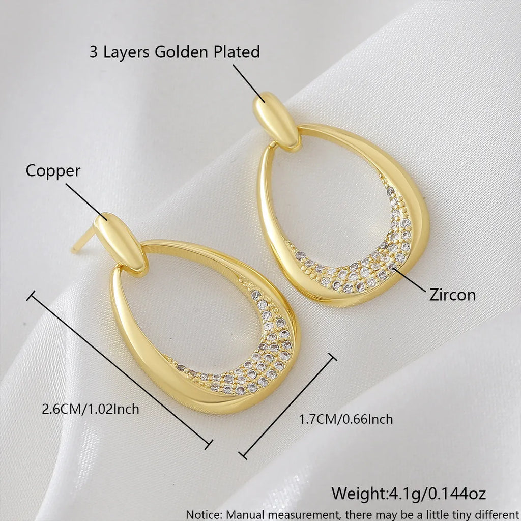 Women's yellow gold geometric drop earrings with zircon detailing measuring 2.6cm by 1.7cm