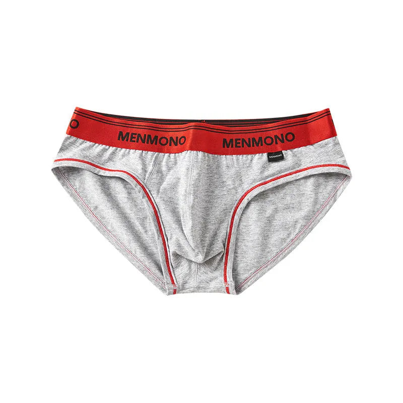 Men's low waist cotton briefs in a selection of solid colours including black and blue, white and red.