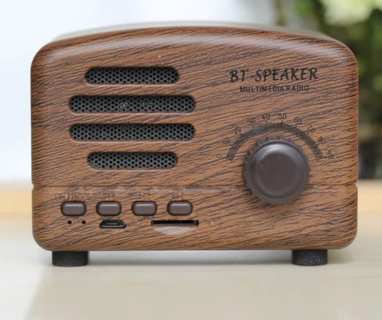 Vintage wood grain Bluetooth speaker with compact dimensions on wooden surface