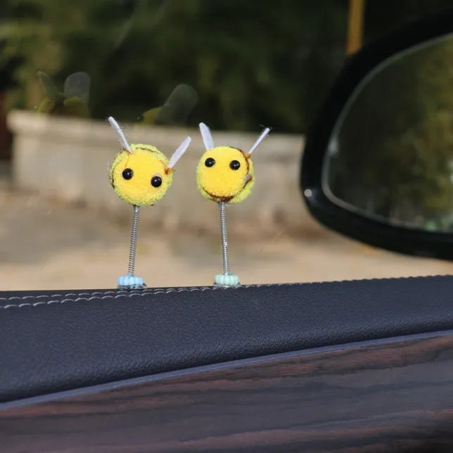 Swing spring bee car decoration with fur ball construction and cartoon design measuring 3x3cm