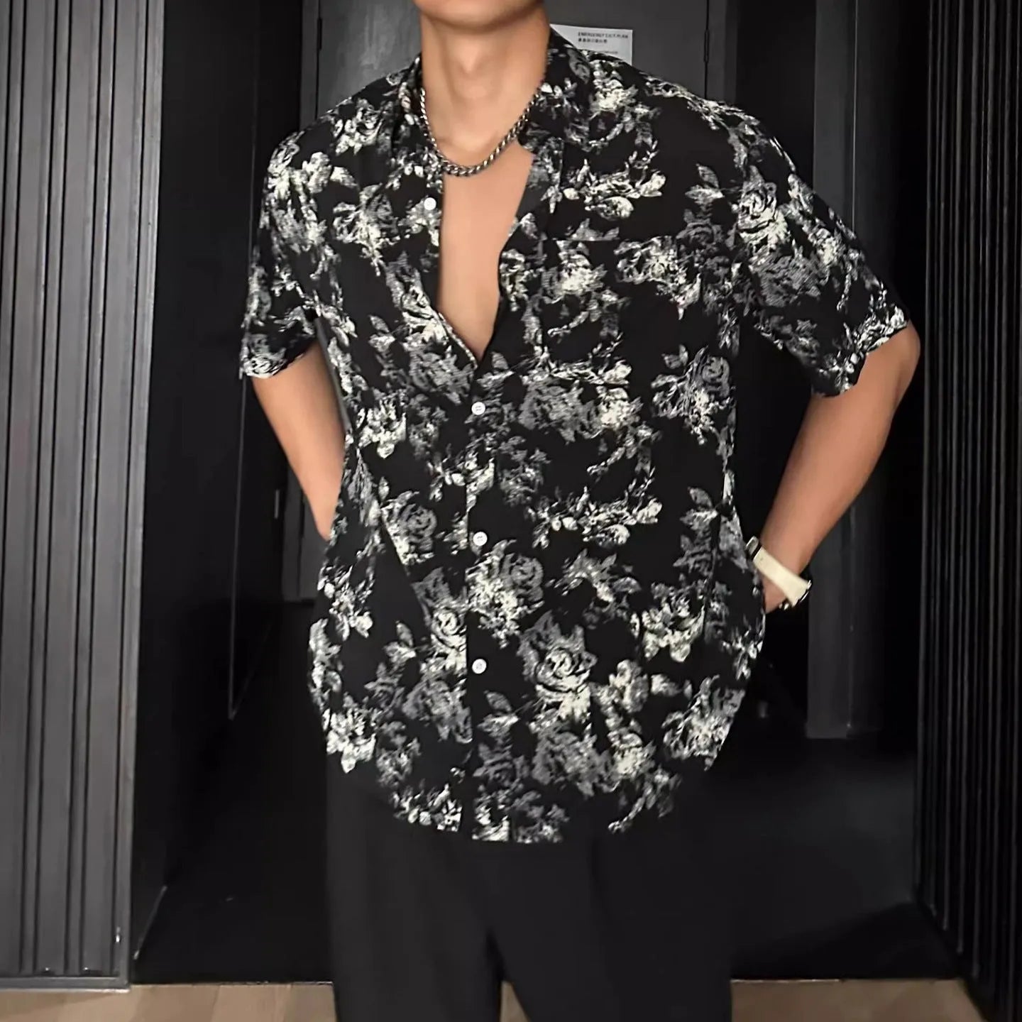 Men's loose black floral printed casual shirt with short sleeves and cardigan style
