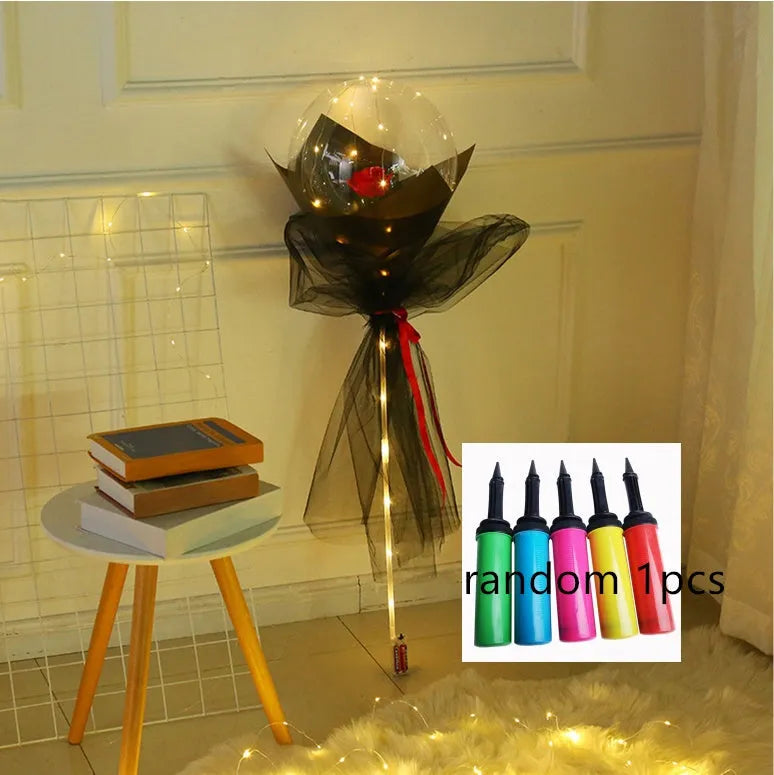 Transparent LED luminous balloon with artificial rose and built-in light, shown as a DIY bouquet kit.