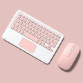 Pink wireless keyboard and mouse combo with slim touch keyboard and Bluetooth connectivity on wooden desk
