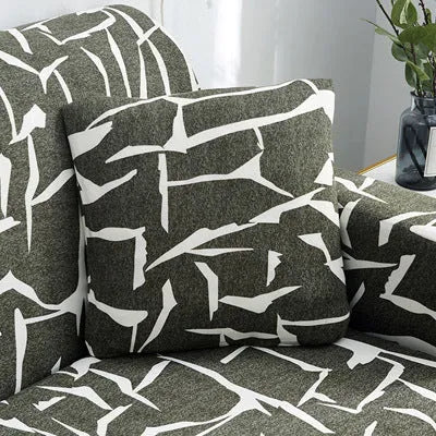 Geometric print polyester sofa slipcover stretched over sofa with matching pillowcase