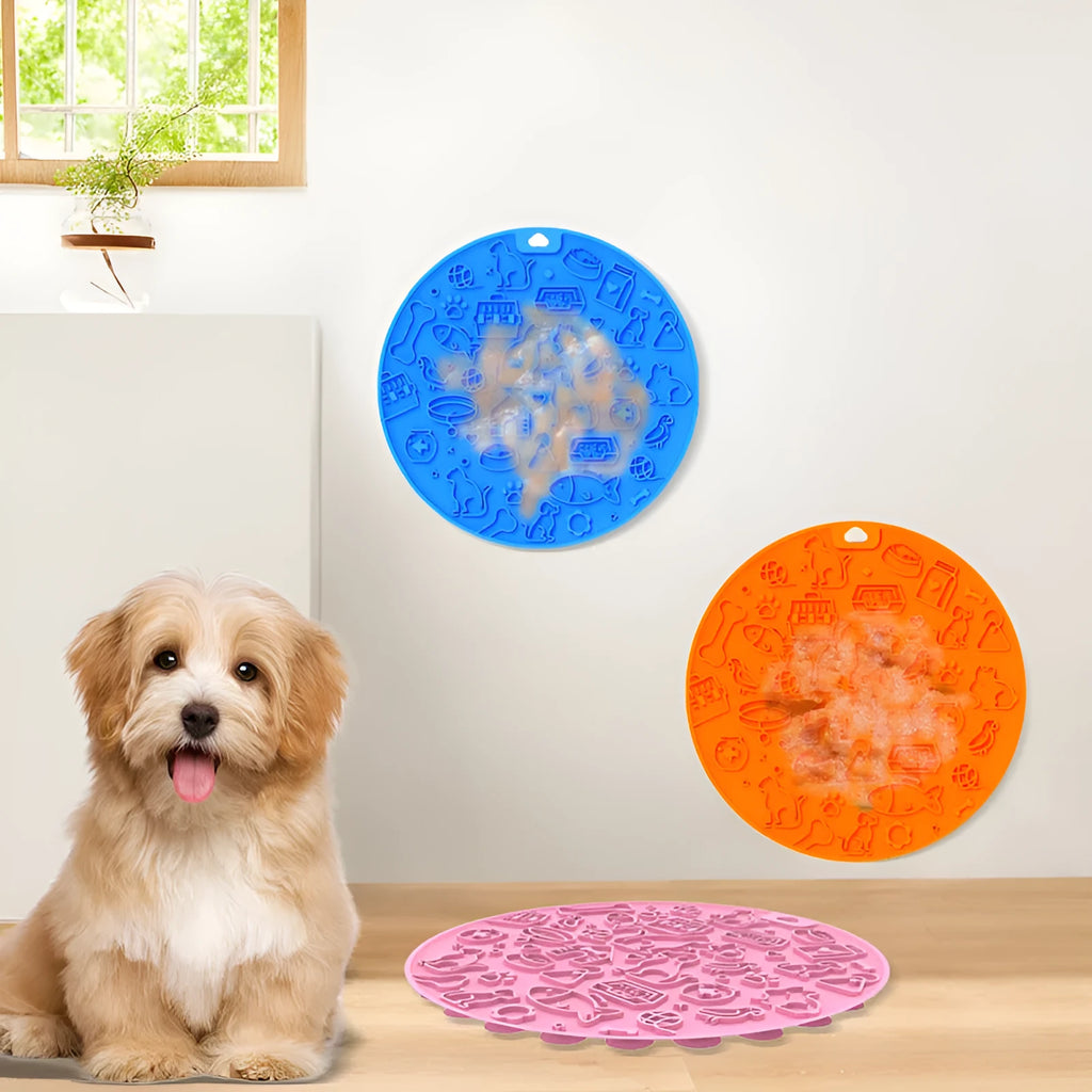 Round silicone pet licking mat with suction cup base in blue colour on a floor.