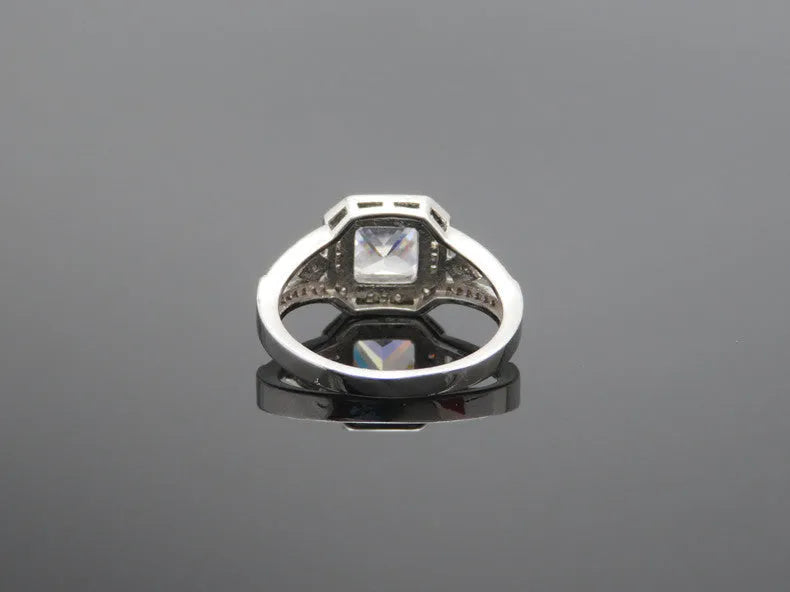 Women's geometric zircon ring with hollow ornamental design and quadrilateral pattern in platinum colour