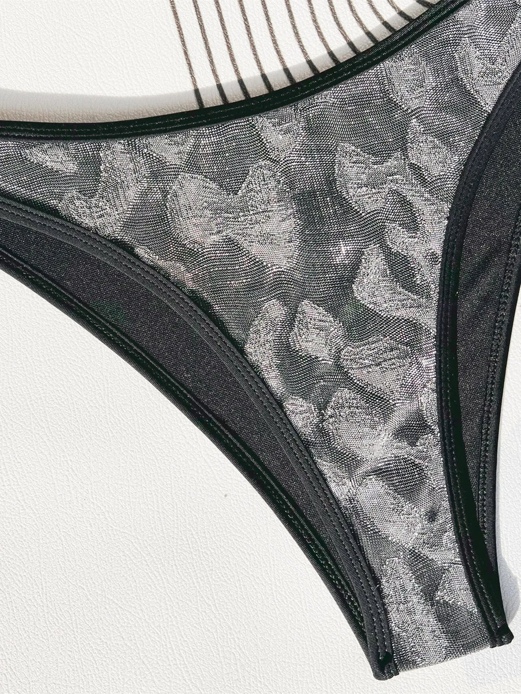 Ladies black bikini strap swimsuit in polyester fabric for swimming activities