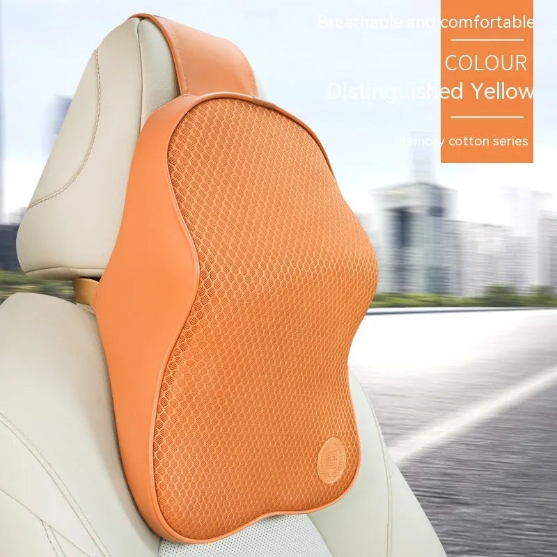 Black and brown memory foam car headrest pillow and lumbar support cushion set on a car seat.