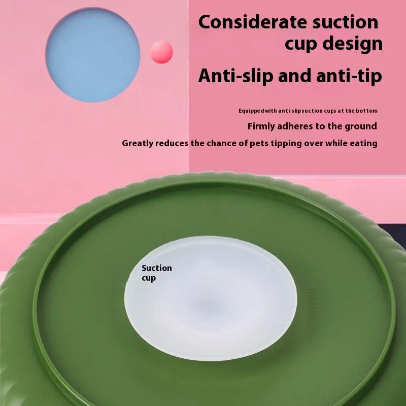 Grey rotating pet slow feeder bowl with a blue silicone windmill-pattern licking mat attached.