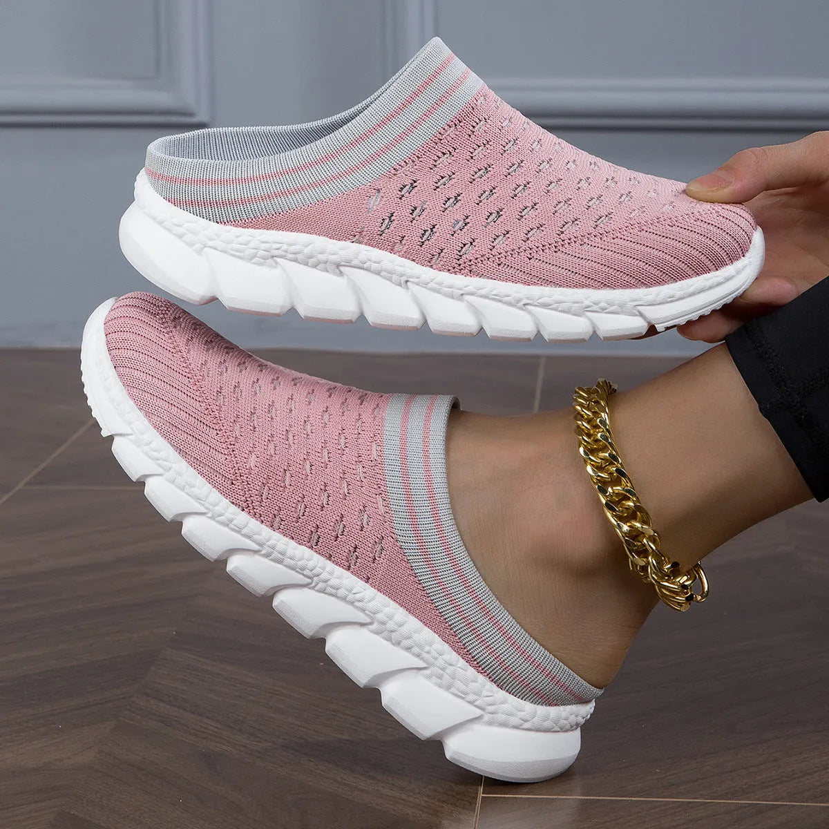 Women's black Flyknit semi slippers with hollowed-out sewing line detail and viscose sole