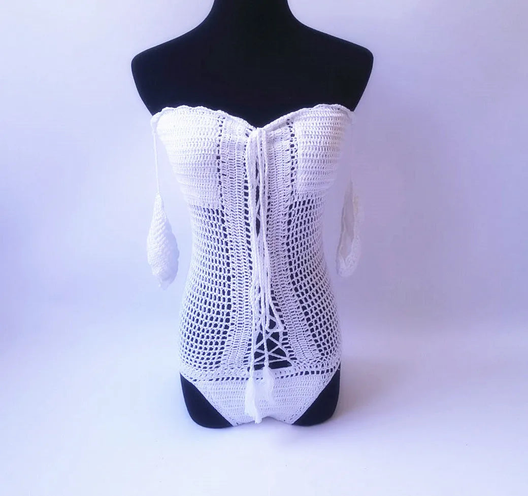 Women's off-shoulder one-piece swimsuit on a mannequin, shown in a light colour.