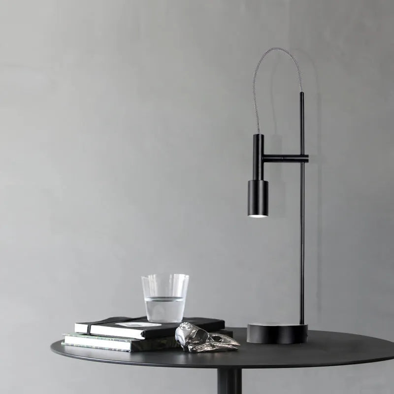 Simple modern rotating table lamp in sand black finish with wrought iron base and G9 bulb, suitable for bedside use