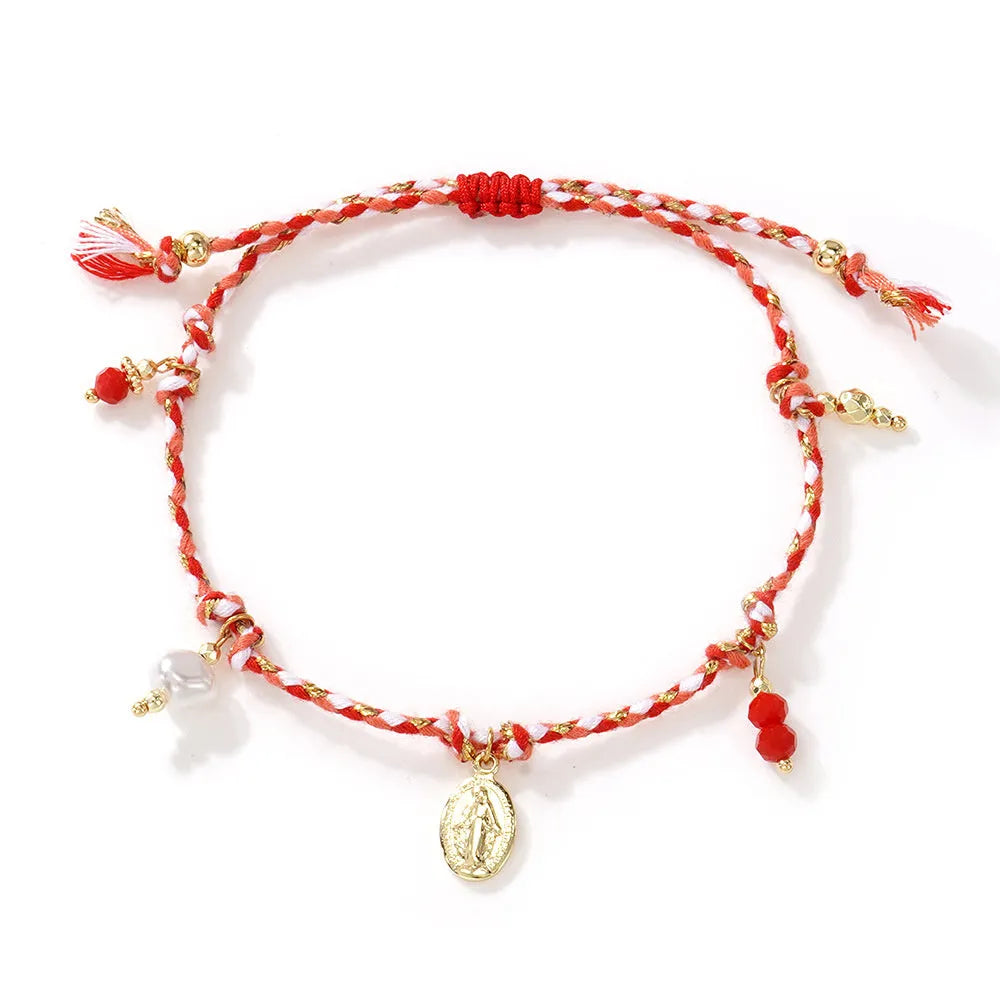 Close-up of a hand-woven colourful braided rope bracelet for women with a carrying strap tag.