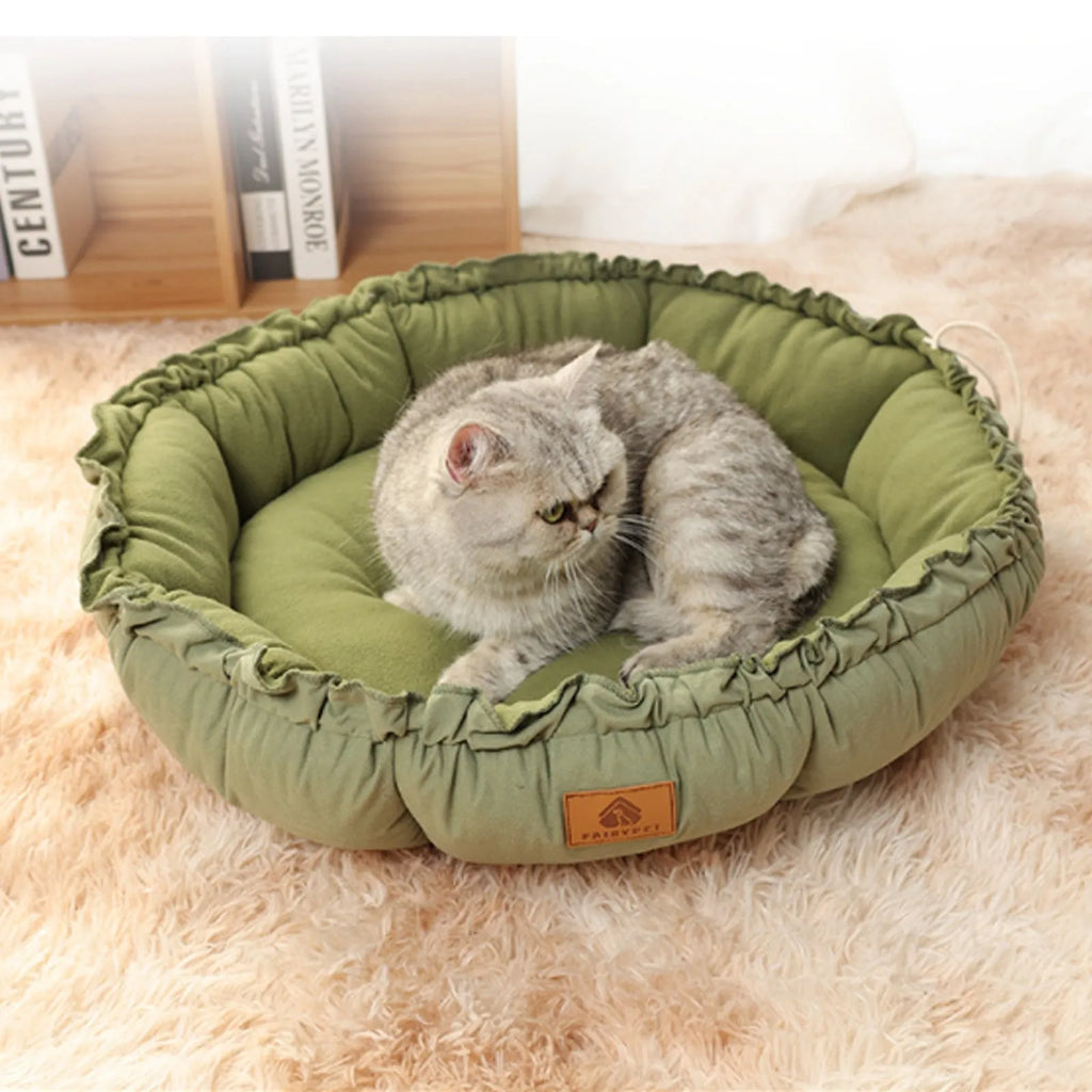 Grey reversible donut cat bed with raised rim suitable for indoor cats and small dogs