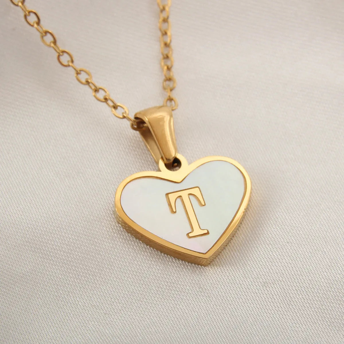 Gold plated personalised heart necklace with white shell on a 45cm chain
