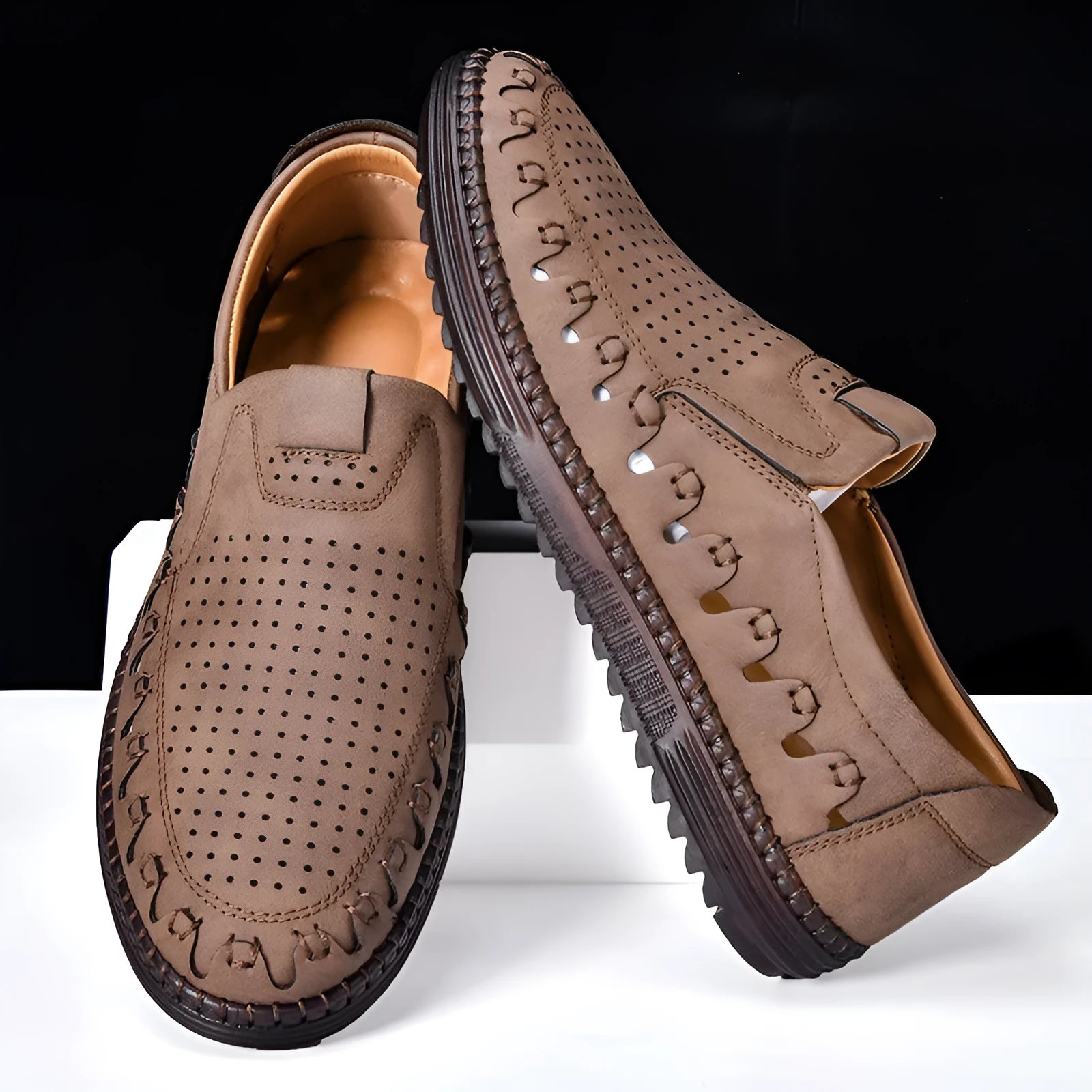 Men's brown slip-on casual shoes with round toe, flat heel, and visible sewing line details.
