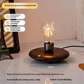 Black suspension bulb night lamp with wooden base on desktop