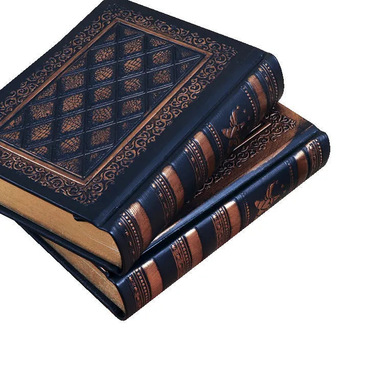 Embossed faux leather notebook in bronze colour, open to show thick white pages.