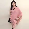 Women's casual plush triangle shawl cape with tassel details in a cashmere and acrylic fabric blend.