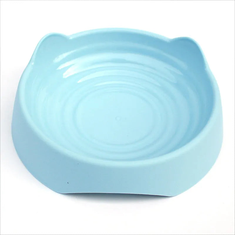 Blue ceramic dog slow feeder bowl with raised maze pattern inside for slowing down fast eaters.
