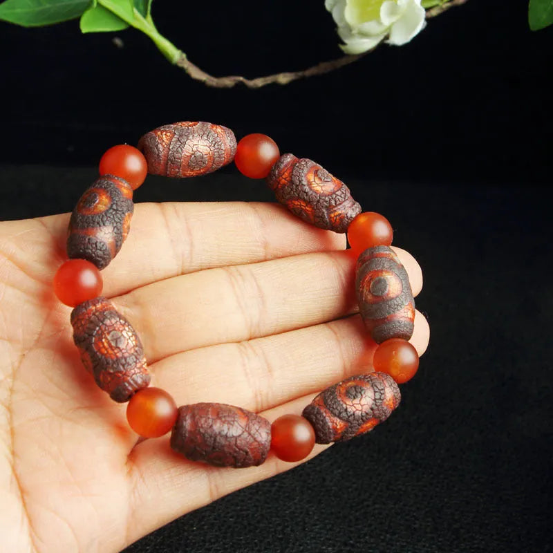 Agate Tibetan dzi bead bracelet with three-eye design and polished finish