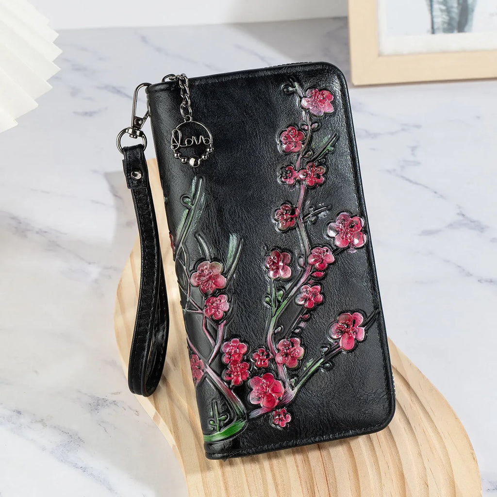 Embossed Chinese style handbag with floral pattern and zipper closure in black colour