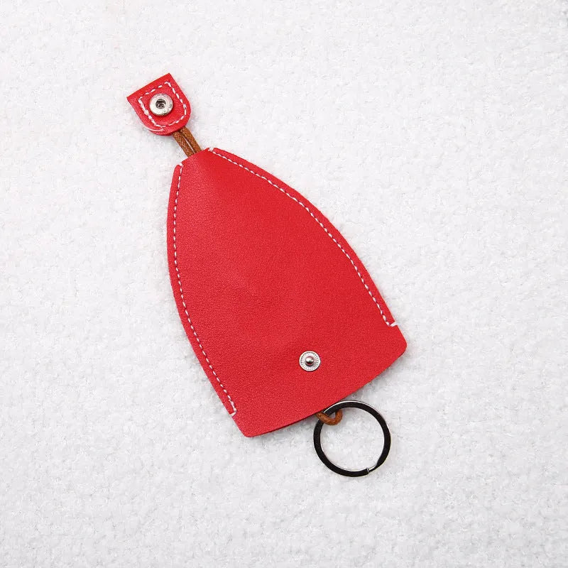 Cartoon pull-out key case in PU leather showing design options including resin fruit and big cartoon animal prints.