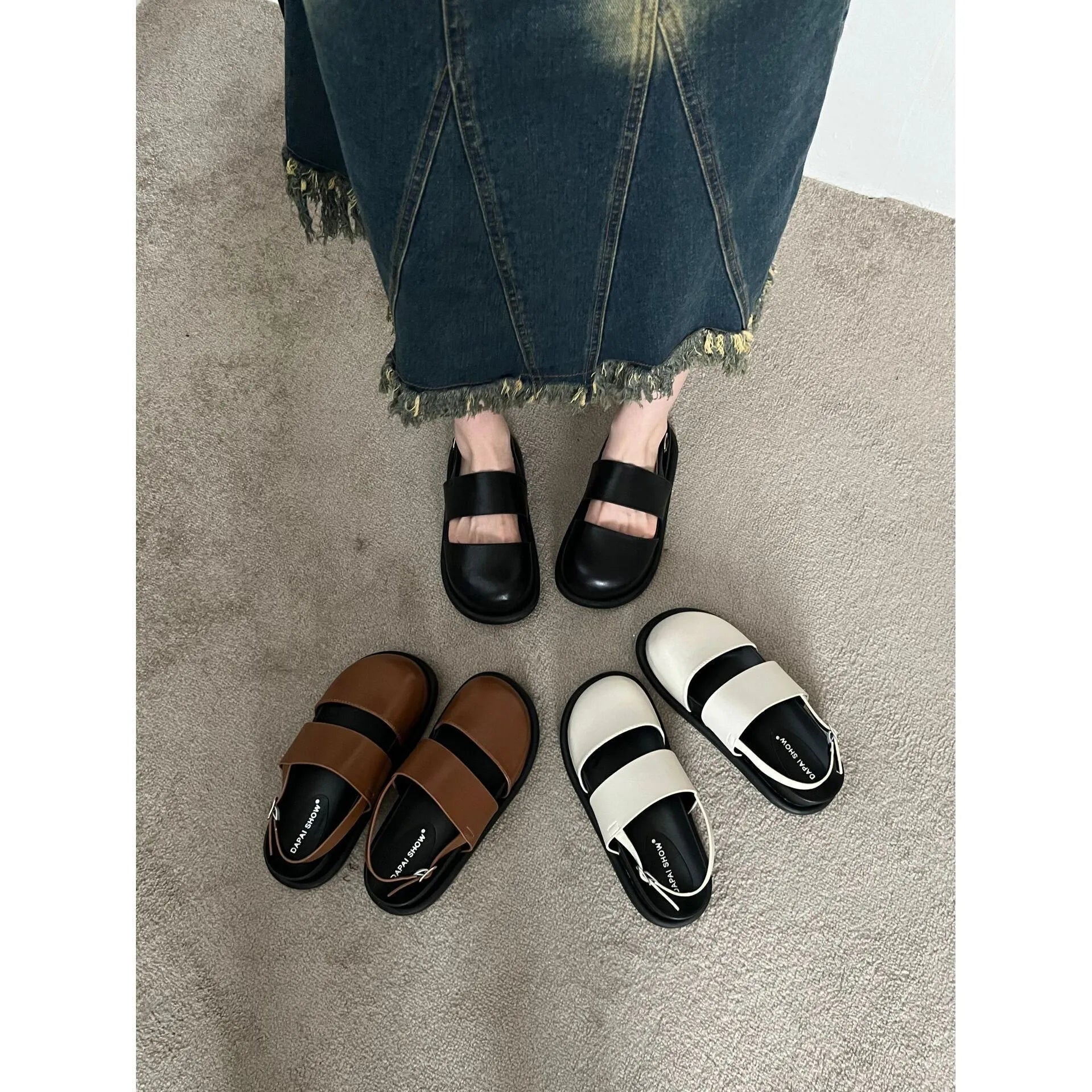 Retro closed toe sandals with raised bottom, ankle strap buckle, and round toe in apricot colour
