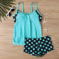 Women's black polka dot boxer swimsuit with high-waisted briefs, made from polyester fabric.