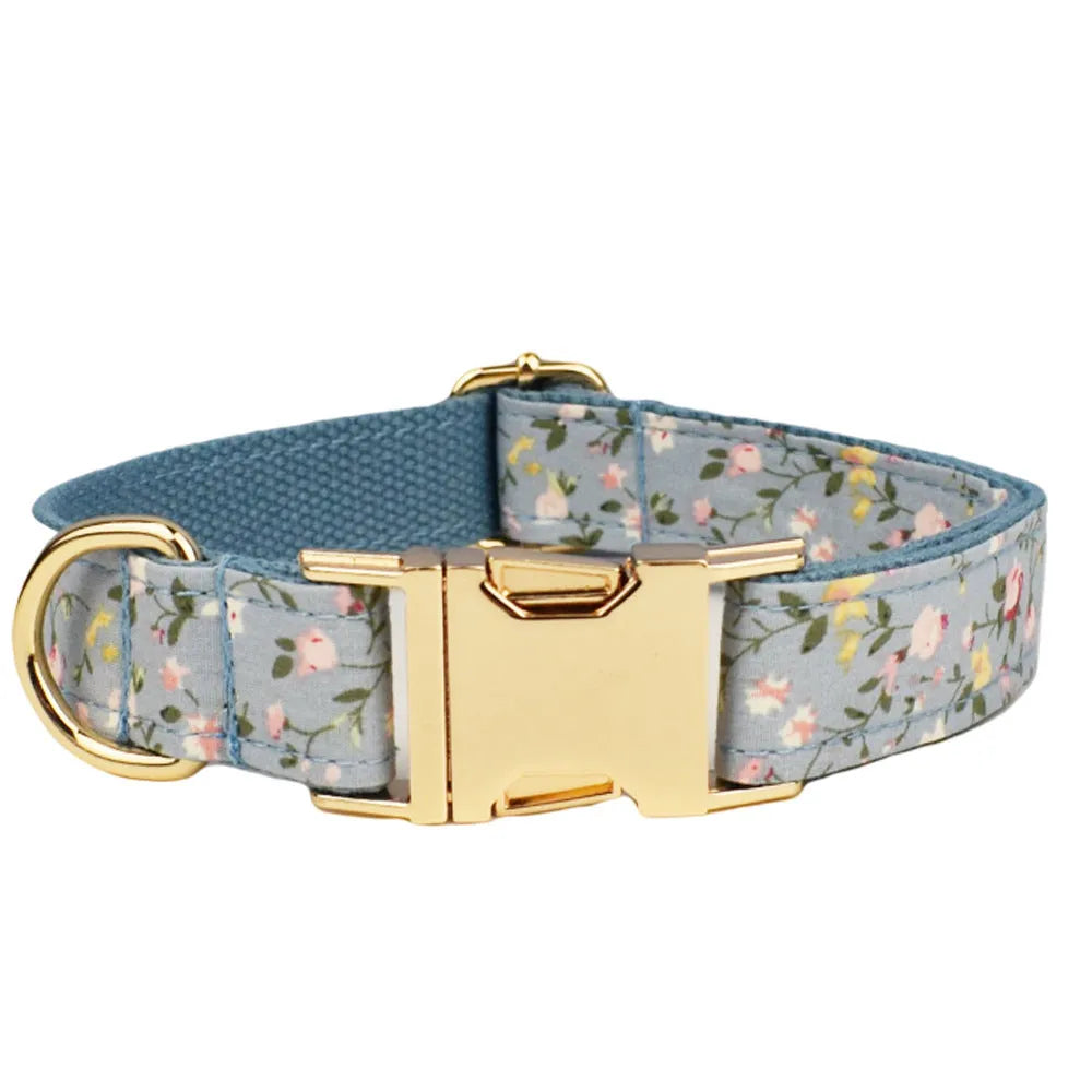 Floral polyester cotton dog collar set with matching leash, vest, bow, and poop bag accessories