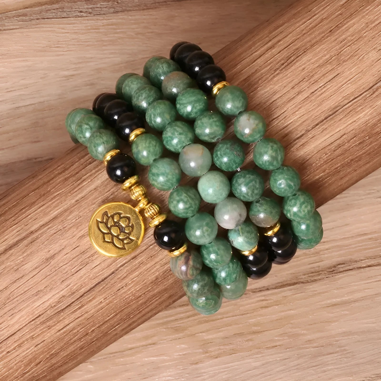 Green and black elastic beaded bracelet with alloy metal construction and natural style design