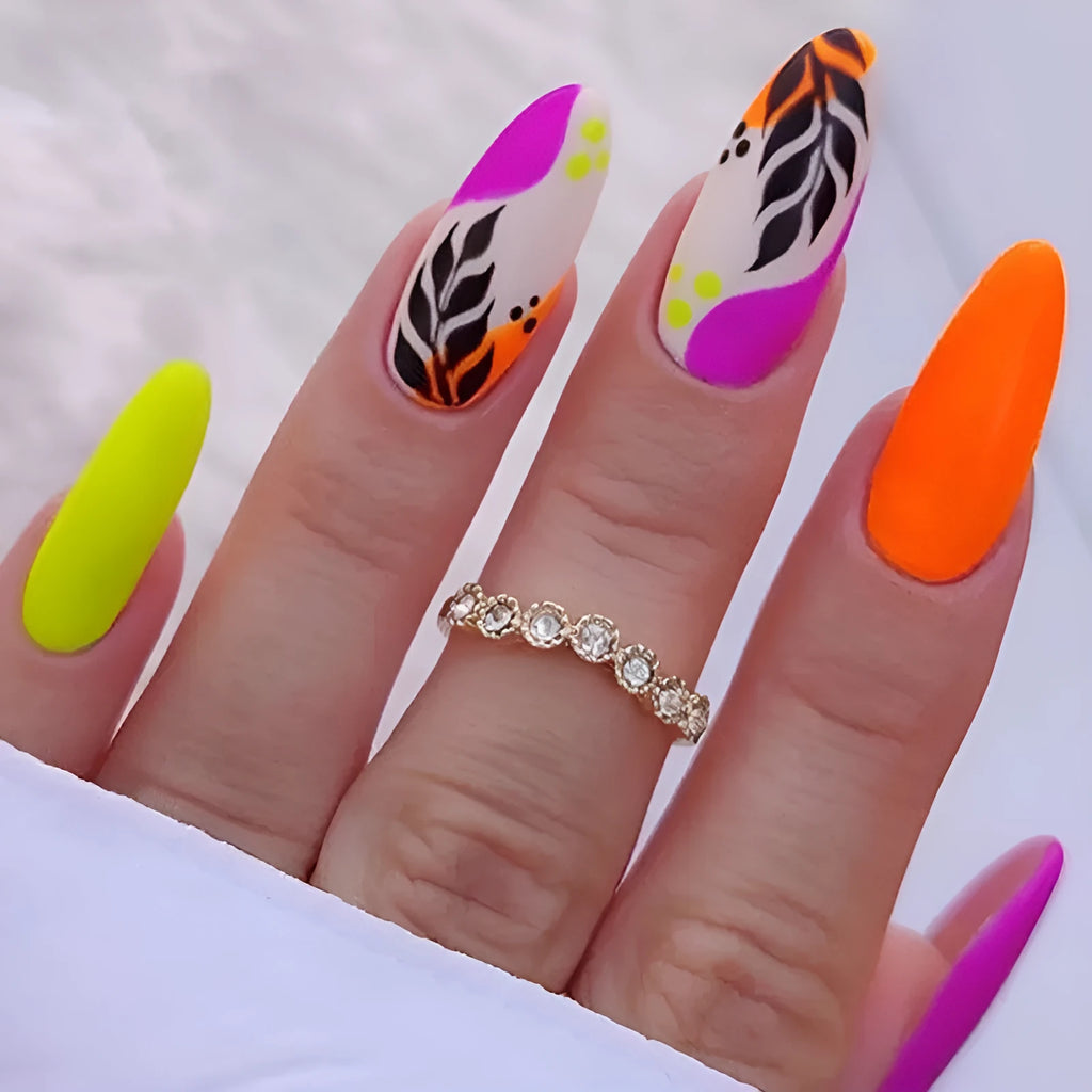 Four boxes of almond shaped nail stickers showing French colourful leaves, colourful plating, star flash macarons, and gradient leopard print designs