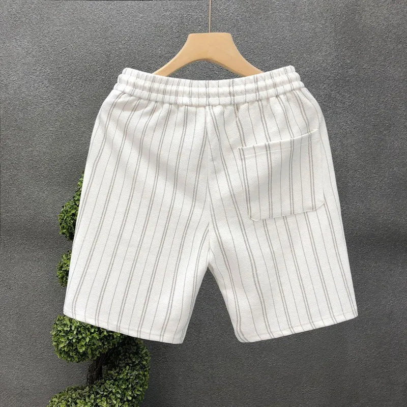 Men's black and white striped fleece-lined casual shorts showing double-layer waistband and straight-leg cut