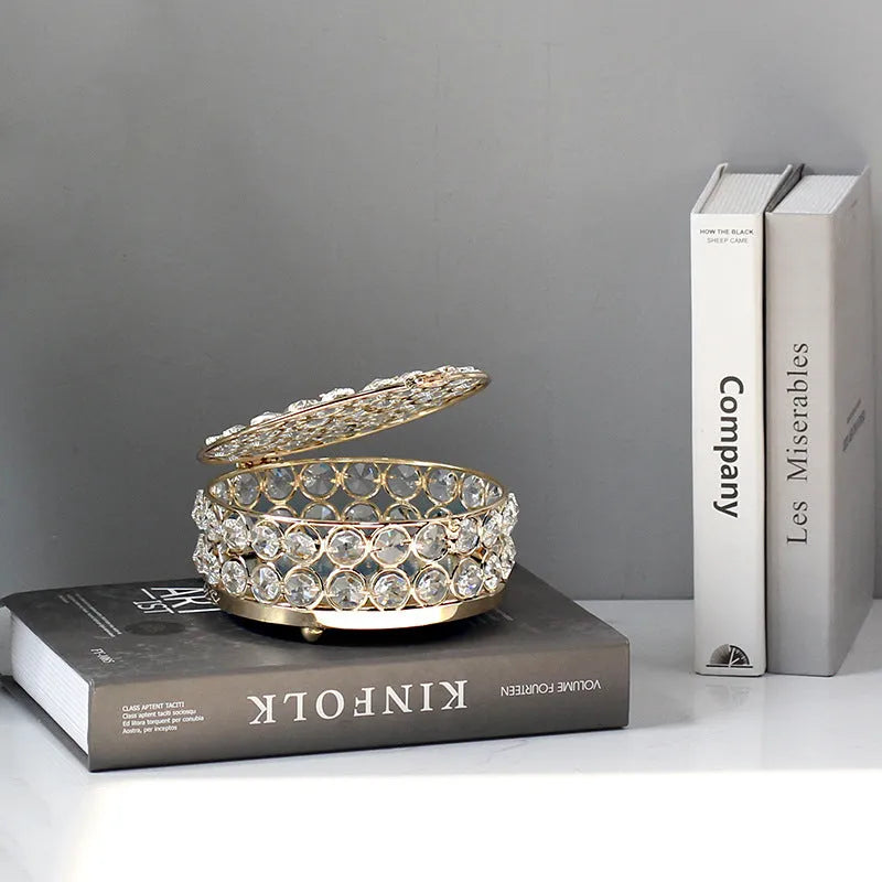 French gold metal frame jewellery box with transparent crystal glass panels displaying contents