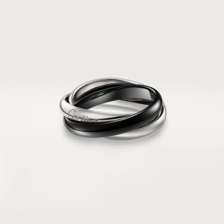 Silver couple rings showing full diamond setting and plain band options on a ring box.
