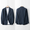Men's loose fit linen suit jacket in a solid colour on a hanger, showing casual long sleeve design.