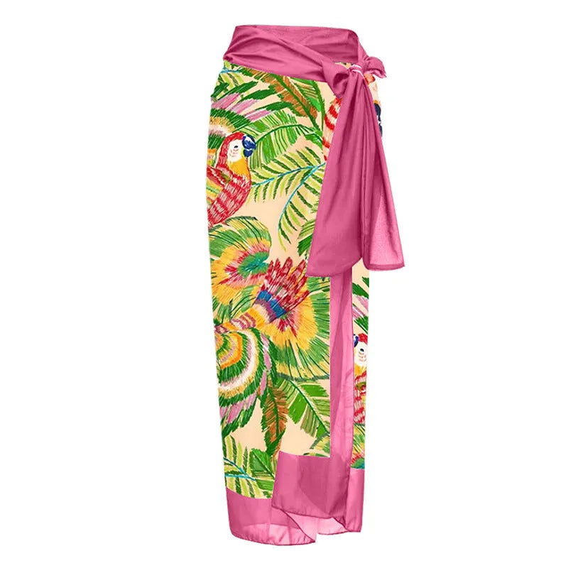 Pink floral print one-piece swimsuit with V-neck, covered belly, and an attached skirt.