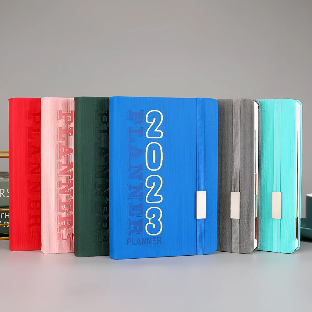 Creative student almanac calendar with imitation leather cover showing wire-o binding and planner layout