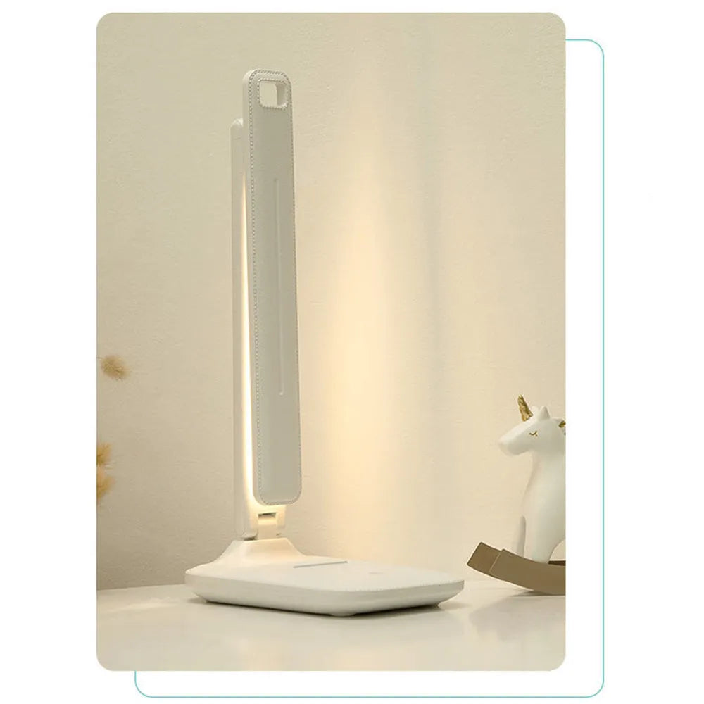 White plastic bedside lamp with touch controls for children's bedrooms