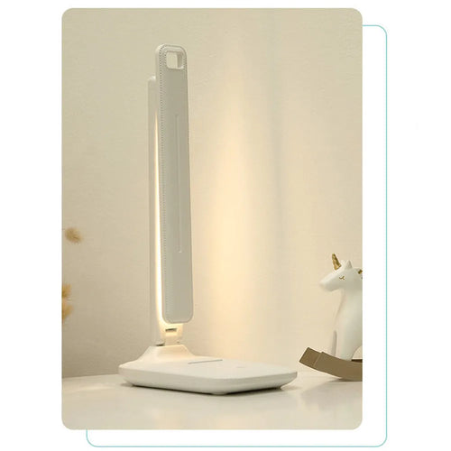 White plastic bedside lamp with touch controls for children's bedrooms