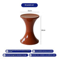 Plastic hourglass-shaped shoe changing stool shown in available colours.