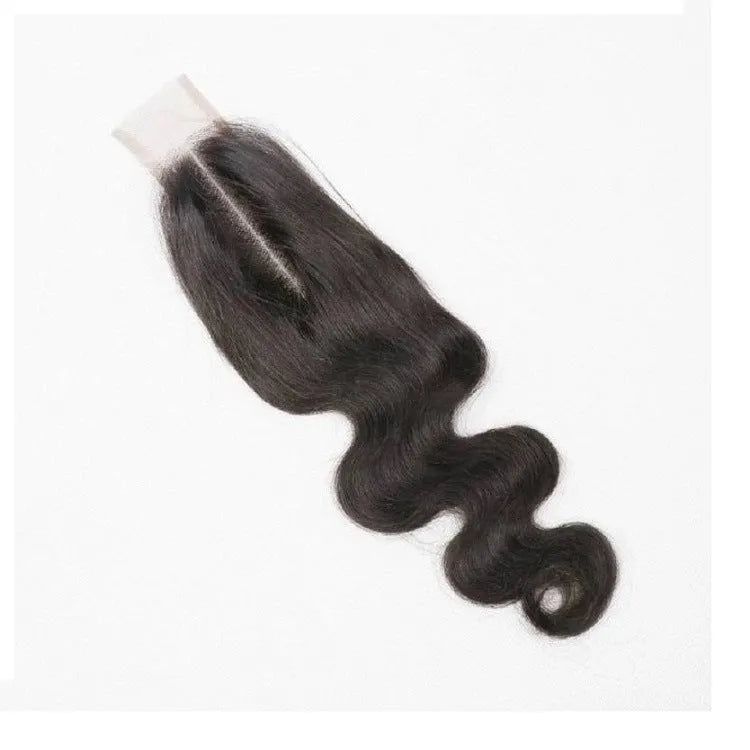 A woman wearing a straight, natural colour human hair wig in a medium length.